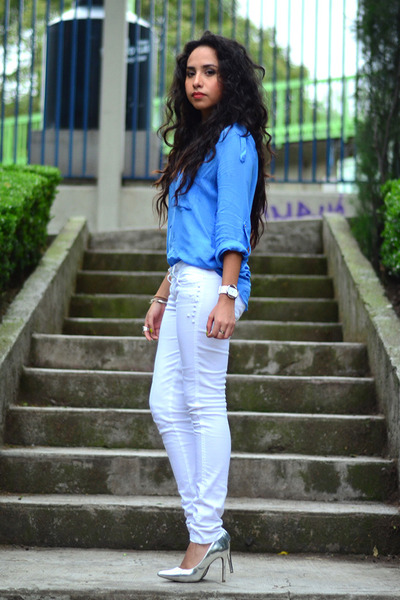 blue blouse and white pants