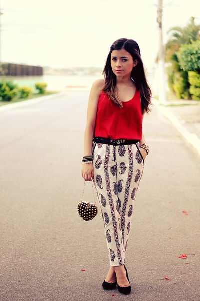 red blouse and white pants