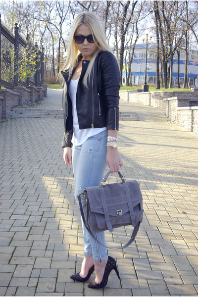 black leather jacket with light blue jeans