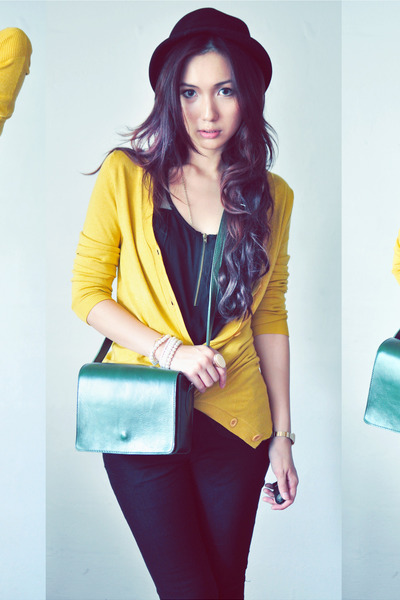 black shirt - dark green bag - mustard cardigan